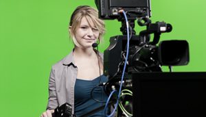Bild einer Frau hinter einer Kamera